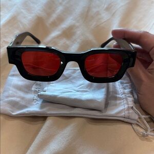 Black Sunglasses with Red Lenses